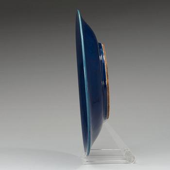A blue glazed dish, Qing dynasty (1644-1912), with Qianlong seal mark.