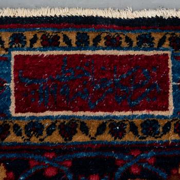 A CARPET, semi-antique Yazd, signed ca 525 x 336 cm.