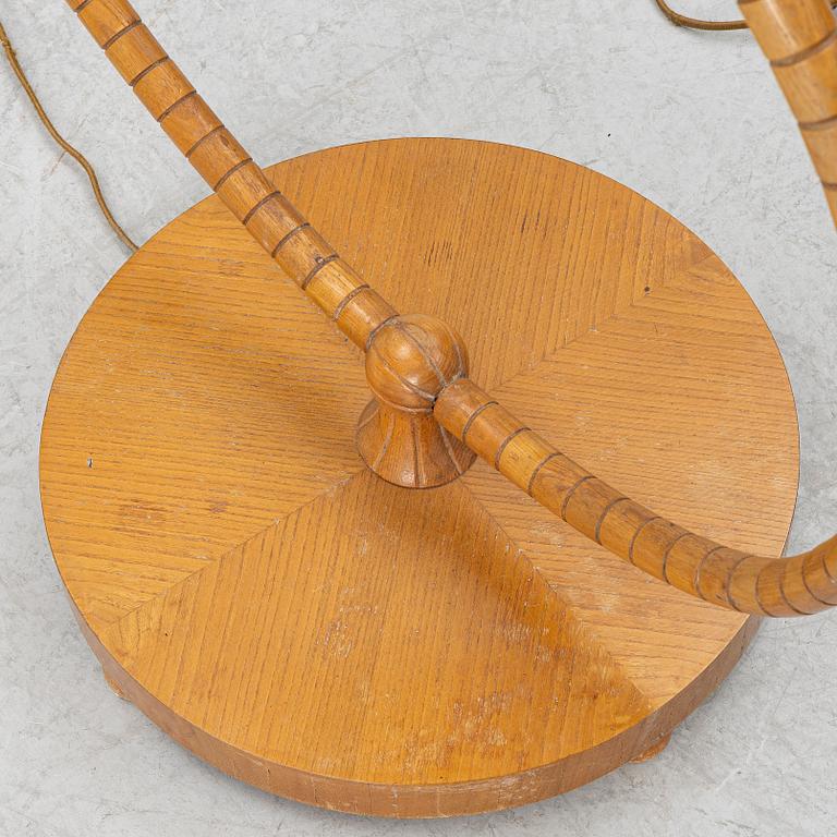 A 1930's/40's floor lamp with table.