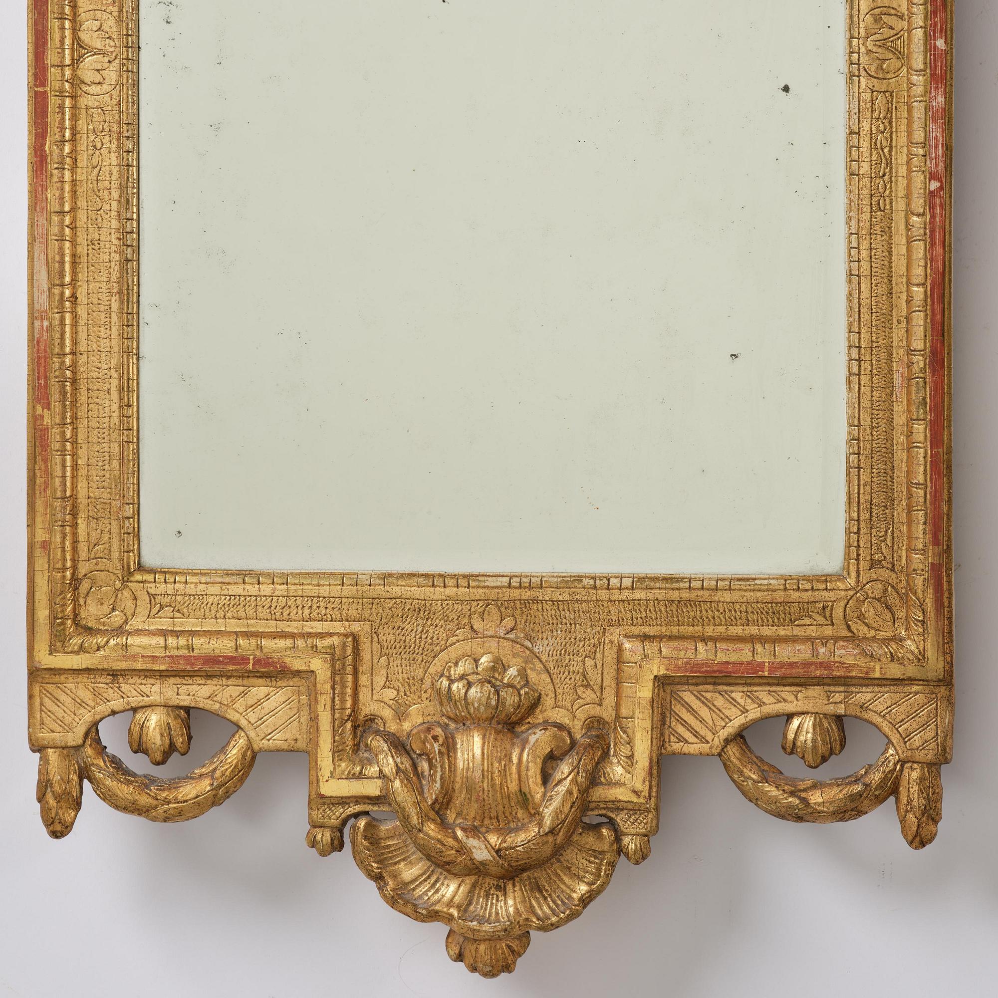 A Trasitional giltwood mirror by J. Åkerblad (master in Stockholm 1758-99).