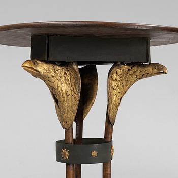 A presumably Russian giltwood and walnut Empire table, early 19th Century.