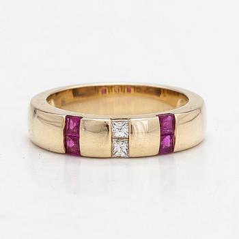 A 14K gold ring with diamonds approx. 0.012 ct in total and rubies.