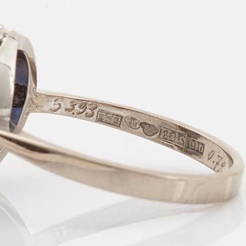 An 18K whithe gold ring set with a faceted sapphire weight 3.93 cts according to engraving.