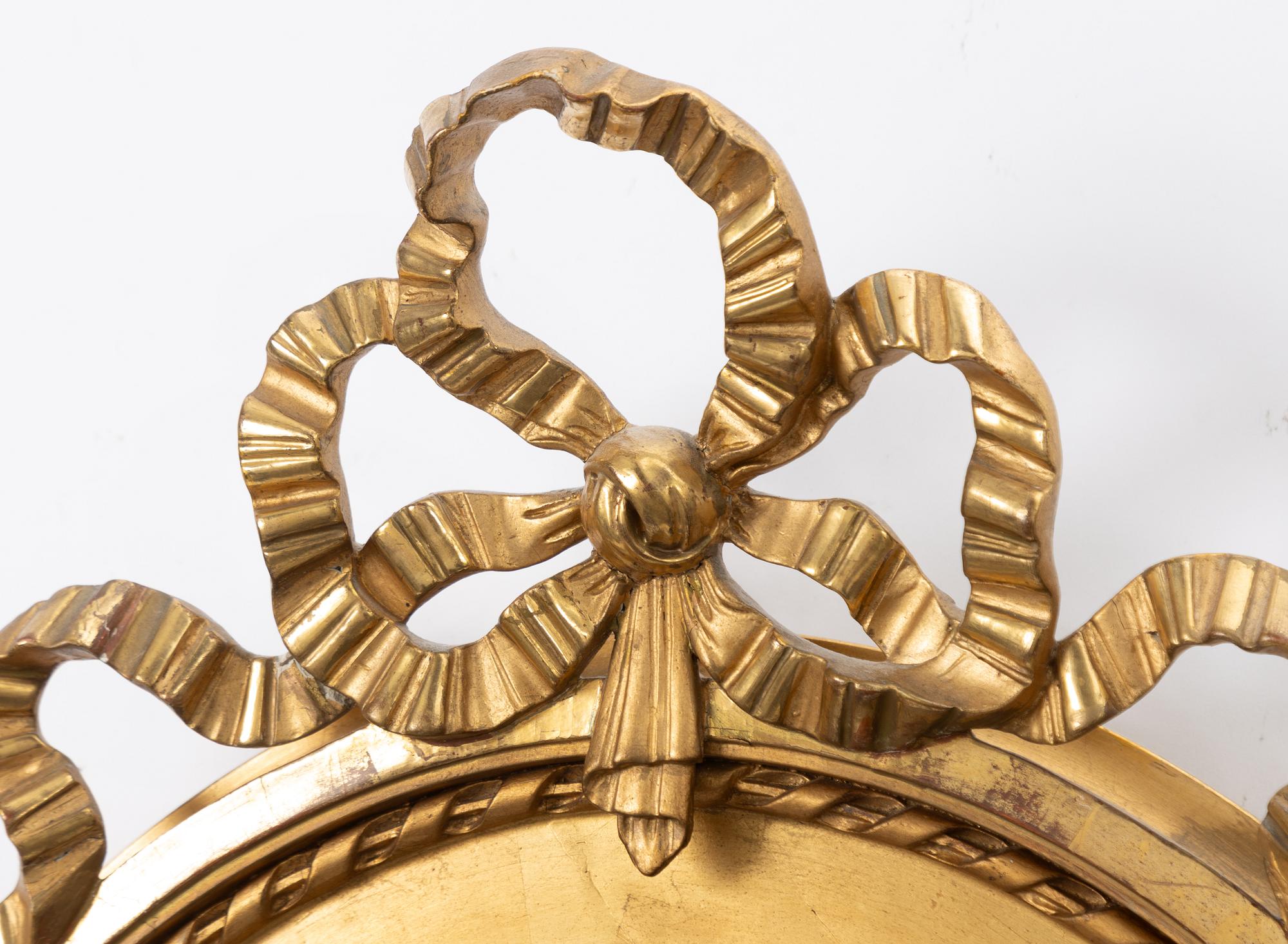 A Gustavian style mirror, early 20th Century.