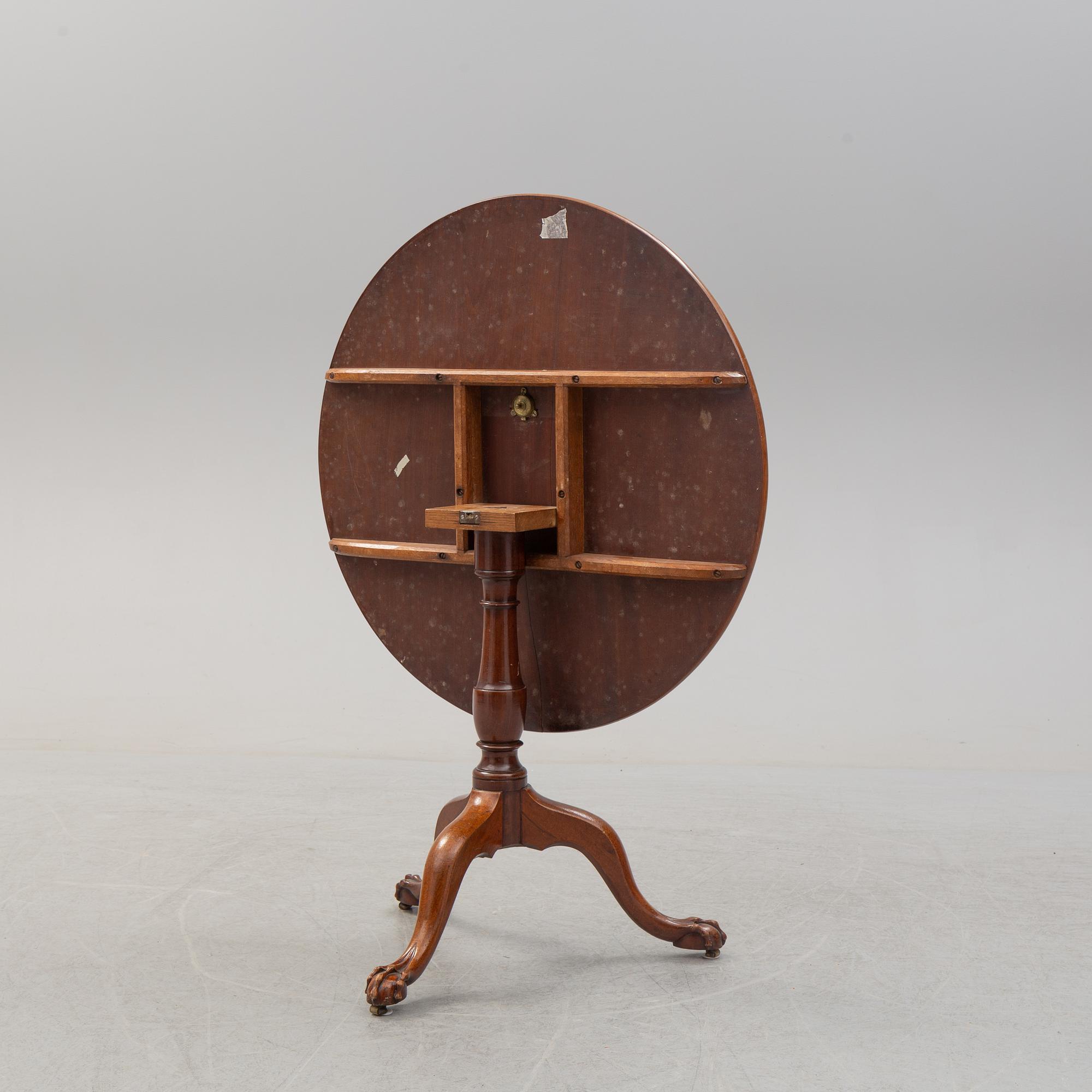 An 18th Century mahogany table.