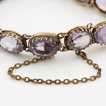 Garniture, necklace and bracelet silver with amethysts, brooch gold-coloured metal with purple paste stones,