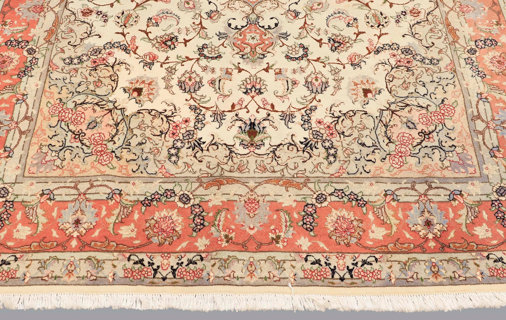A carpet, Tabriz part silk, ca 302 x 200 cm.