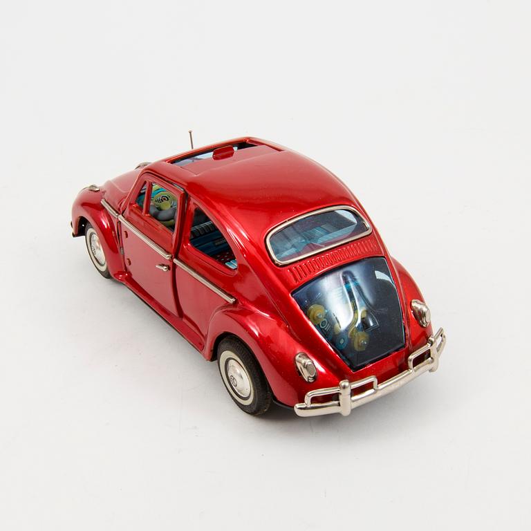 A tinplate Bandai "Volkswagen with openable door", Japan, 1960s.