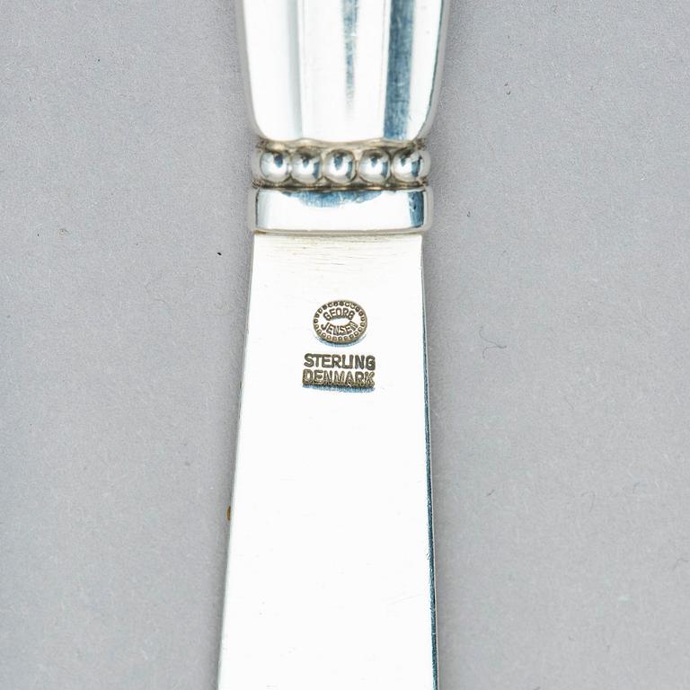 Georg Jensen, a set of 133 pieces of  'Acorn' sterling silver and stainless steel flatware, design Johan Rohde, Copenhagen after 1945.