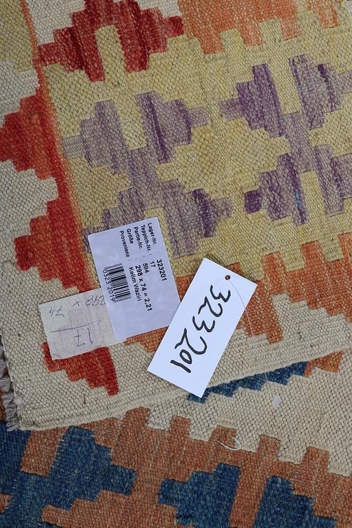 A runner, kilim, ca 298 x 74 cm.