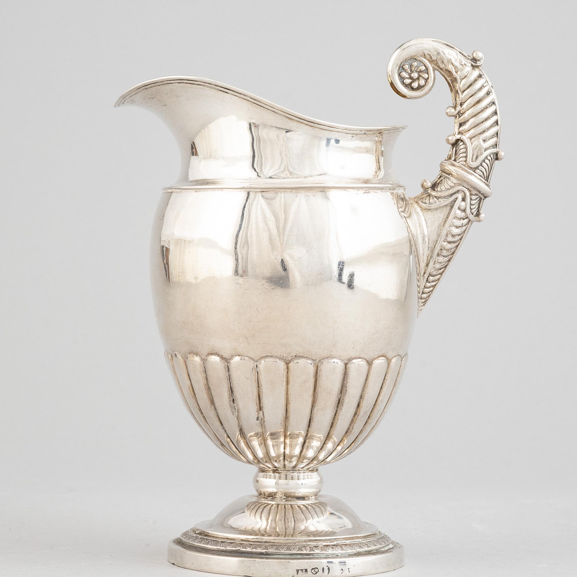 A Swedish empire parcel gilt silver creamer, mark of Anders Lundqvist, Stockholm 1828.