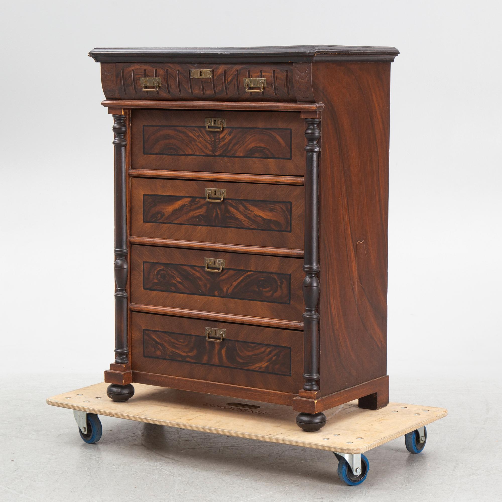 A chest of drawers, circa 1900.