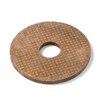 1229. A stone bi disc, Han dynasty (206 B.C.-220 A.D.).