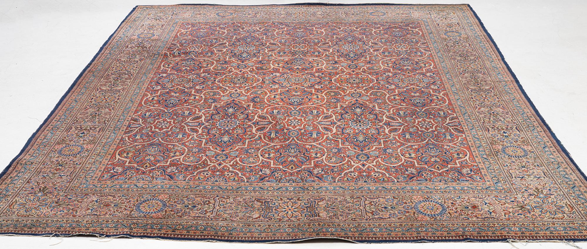 An oriental carpet, c. 425 x 305 cm.