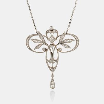 1126. A pendant in platinum and 14K gold set with old- and rose-cut diamonds.