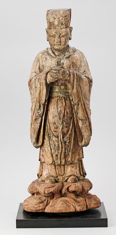 A wooden sculpture of a deity, Ming style.