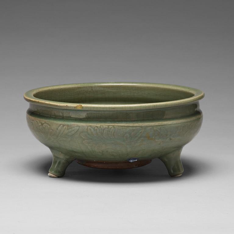 A celdonglazed tripod censer, Ming dynasty (1368-1644).