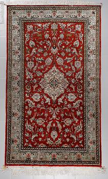 A SILK GHOM RUG, 230 x 138 cm.