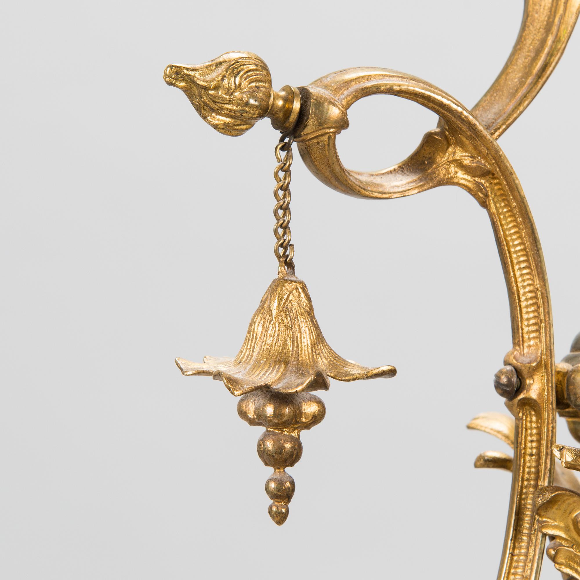 A brass chandelier with prisms, second half of the 19th century. Height 83 cm.