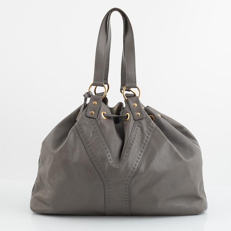 Yves Saint Laurent, a reversible leather tote bag.