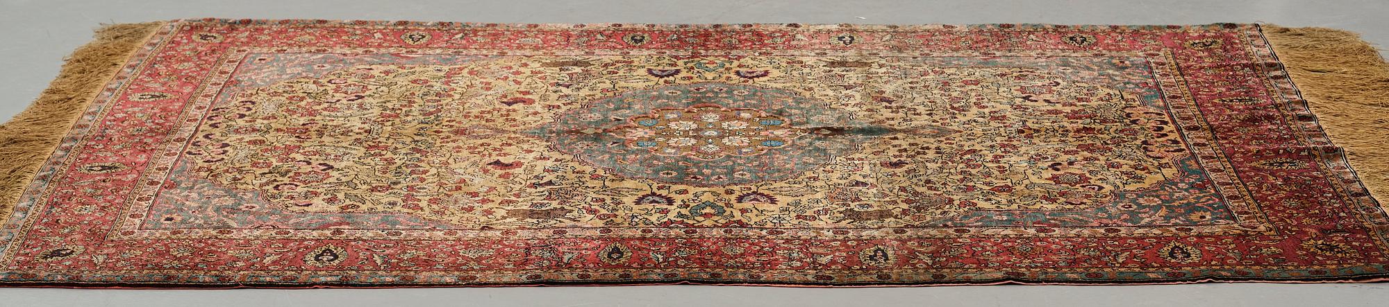 Matto, a semi-antique silk Turkish with metal brocade, ca 194-195 x 127,5-132,5 cm.