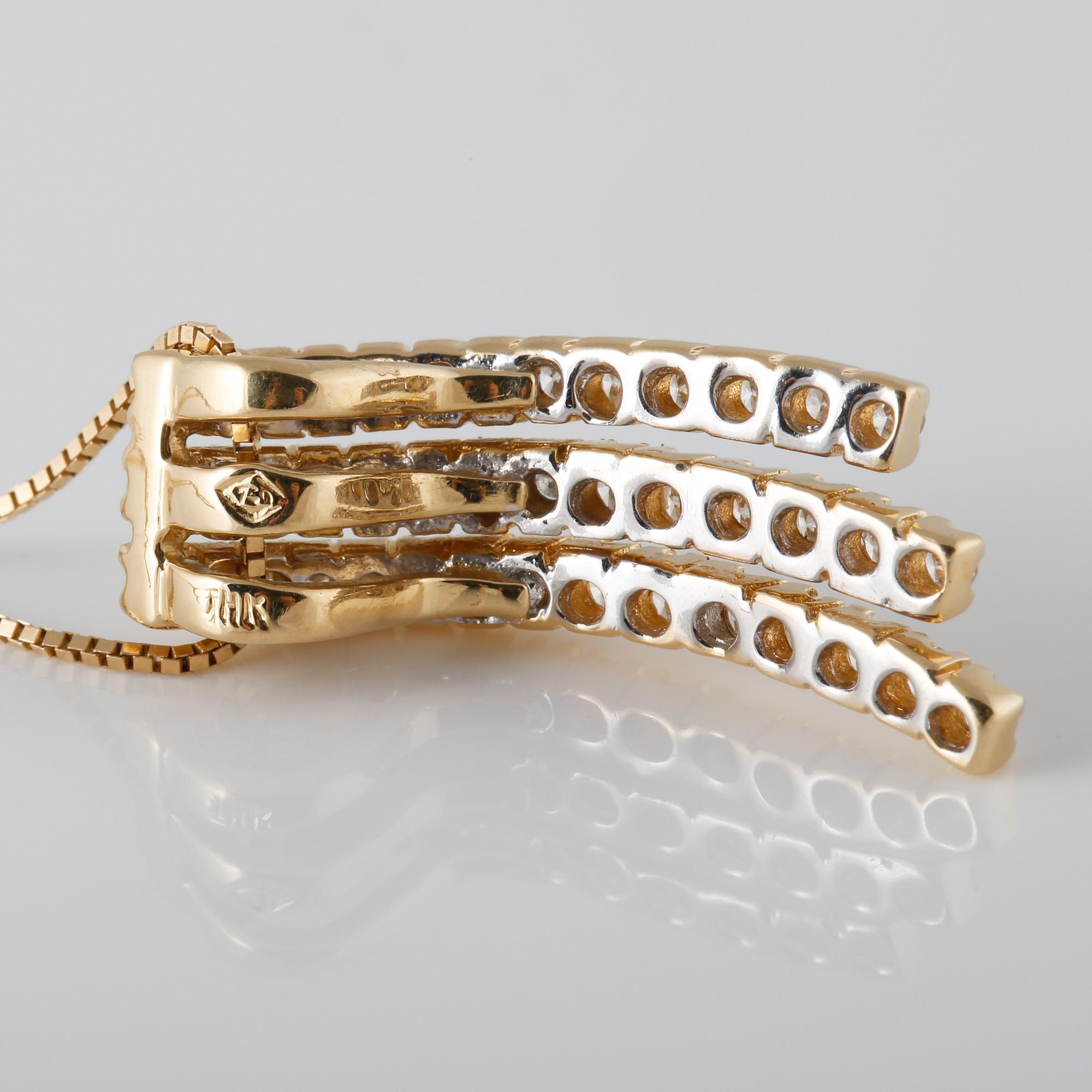 HÄNGE , 14K guld med briljantslipade diamanter ca 1.20 ct. Vikt 5,4 gram.