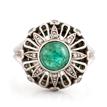 497. An A Tillander ring set with a cabochon-cut emerald.