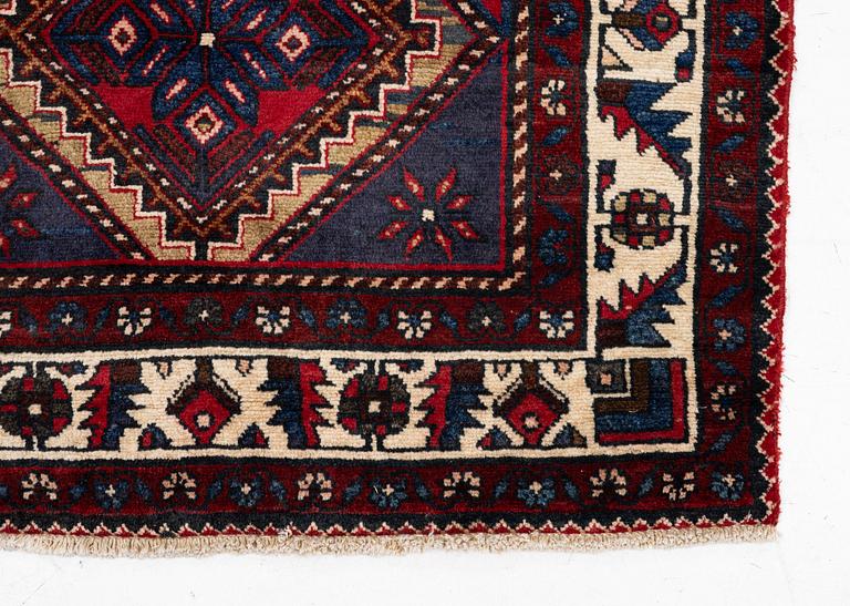An oriental runner, c. 395 x 100 cm.