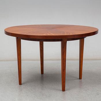 a mahogany dining table from the mid 20th century.