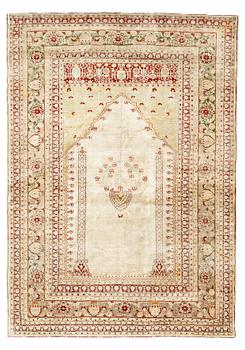 A RUG, an antique silk Tabriz, ca 165 x 118,5-111,5 cm.