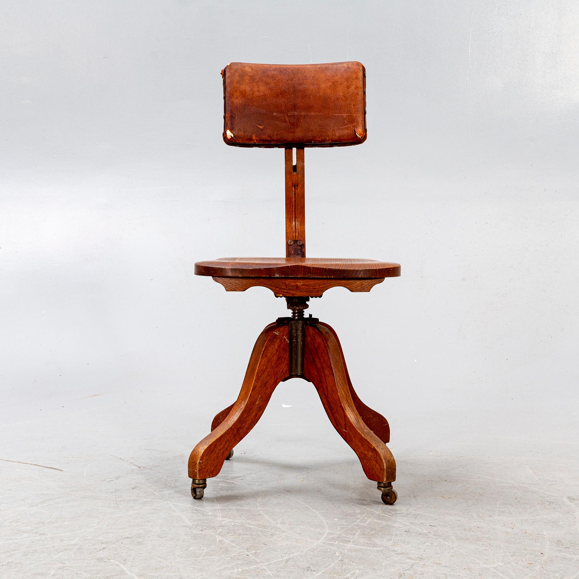 An early 1900s oak office chair.