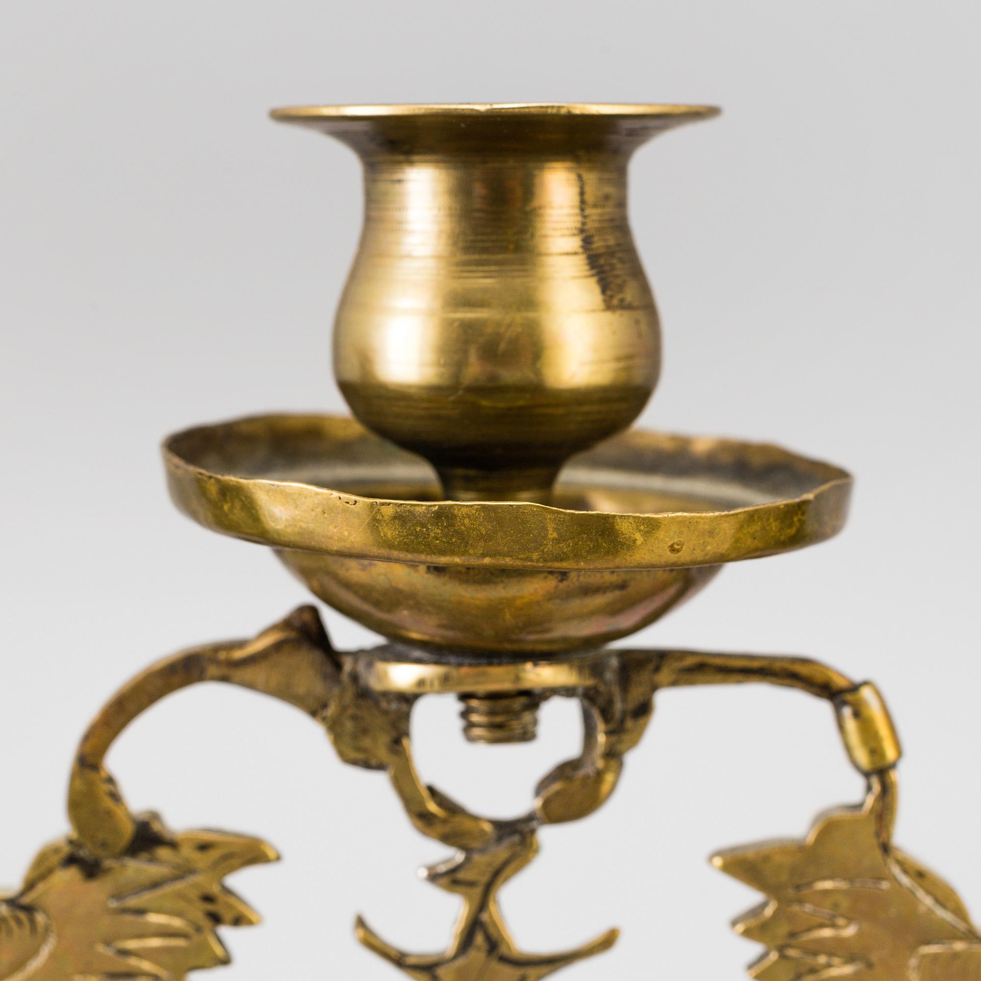 A BRASS CANDELABRUM, CA 1900.