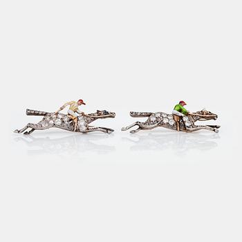 A pair of old-cut diamond and enamel brooches in the shape of jockeys on horses. Circa 1930's.