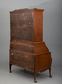 A TWO-PIECE WRITING CABINET.