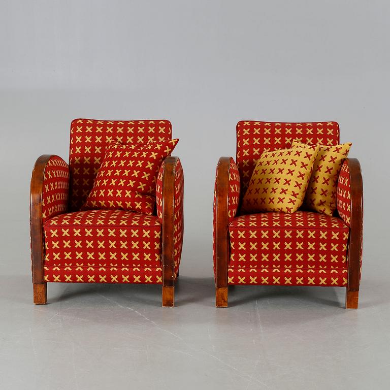A pair of 1930s armchairs.
