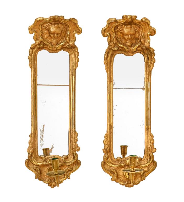 A pair of Swedish Rococo 18th century one-light girandole mirrors.