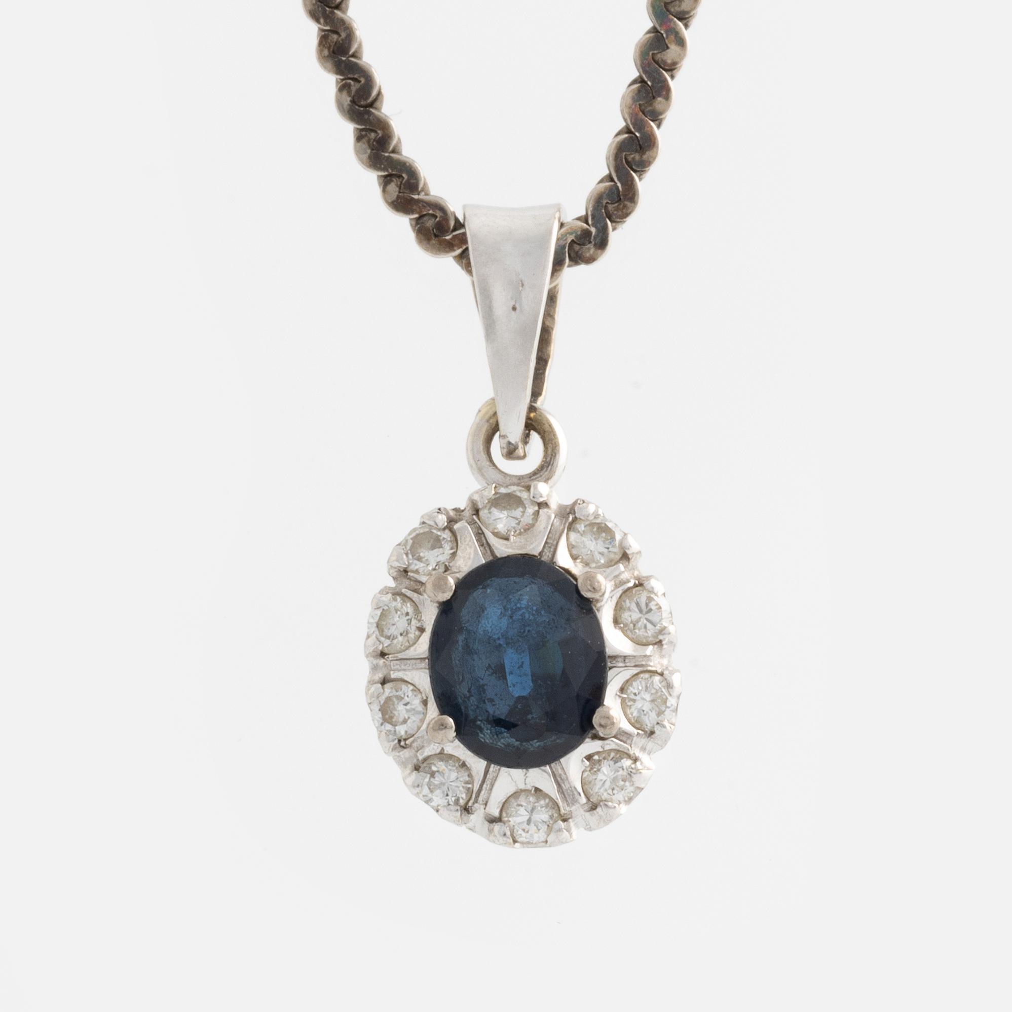 Pendant and a pair of earrings, white gold with sapphires and brilliant-cut diamonds.