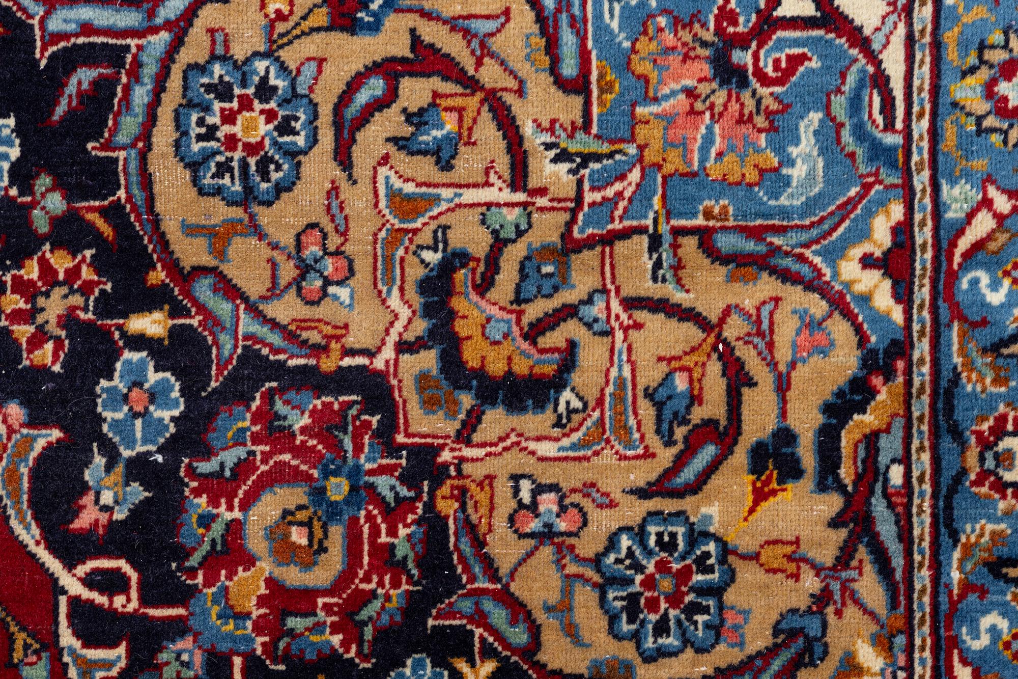 A Kashan carpet, a. 407 x 265 cm.