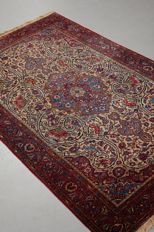 Matto, a semi-antique silk Kashan, ca 212,5-214,5 x 134,5-135,5 cm.