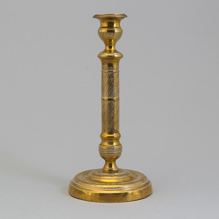 AN EMPIRE ORMOLU CANDLESTICK, first half of the 19th century.