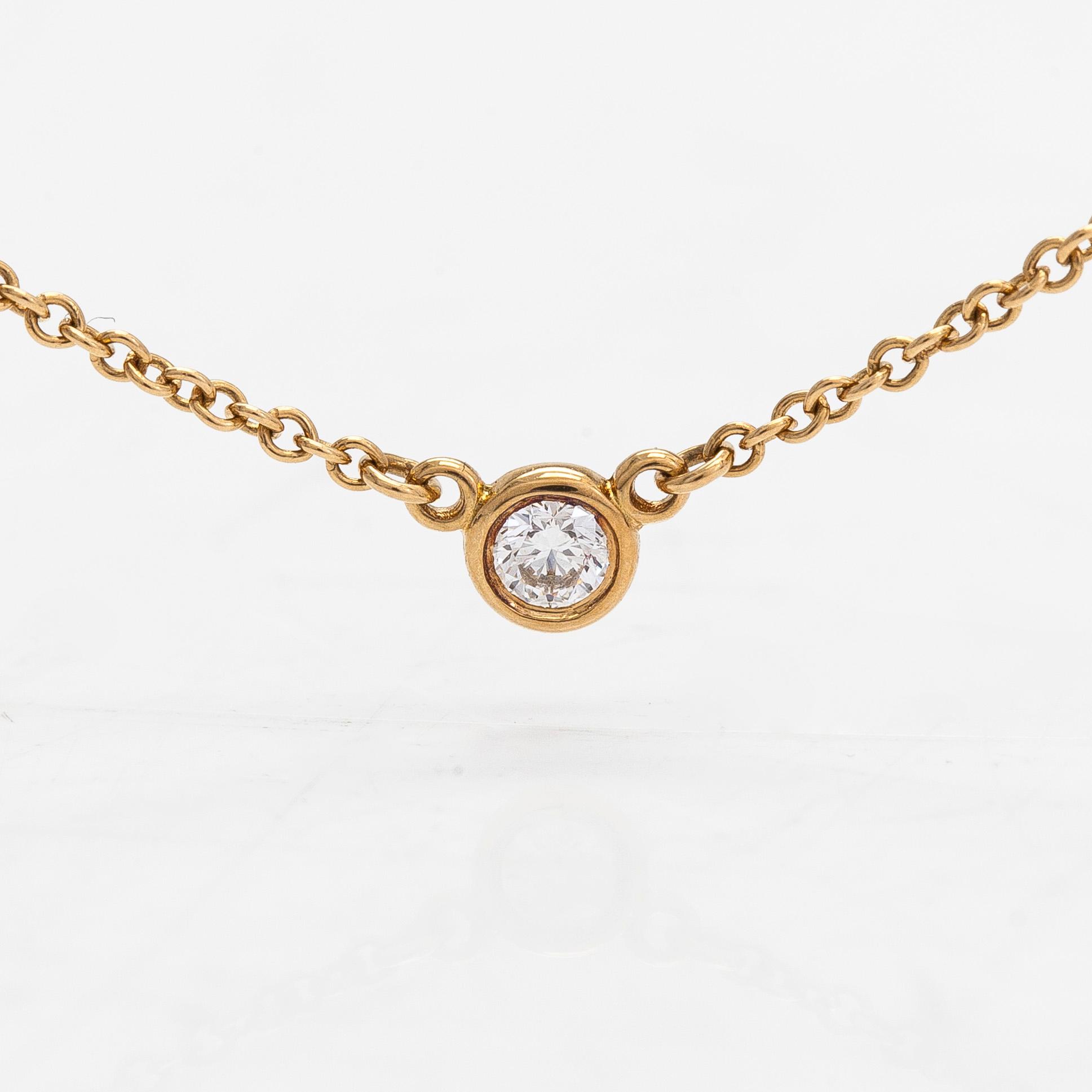 Tiffany & Co, Elsa Peretti, collier, 18K guld med en briljantslipad diamant ca 0.05 ct.