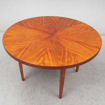 a mahogany dining table from the mid 20th century.