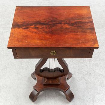 An early 20th century sewing table.