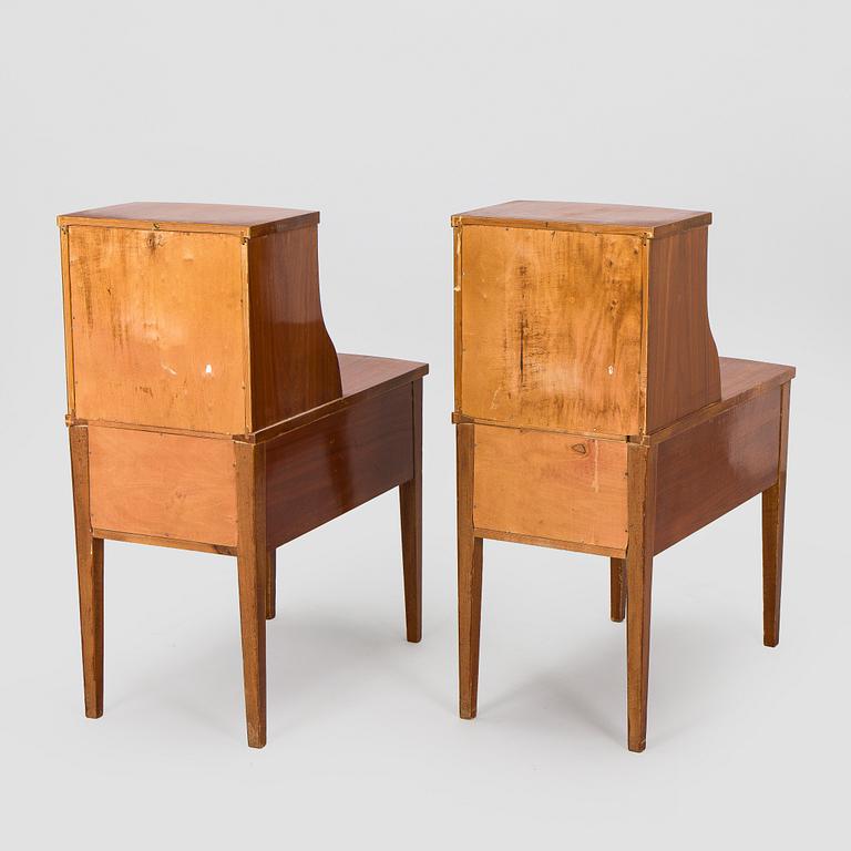 A pair of 20th century bedside tables.