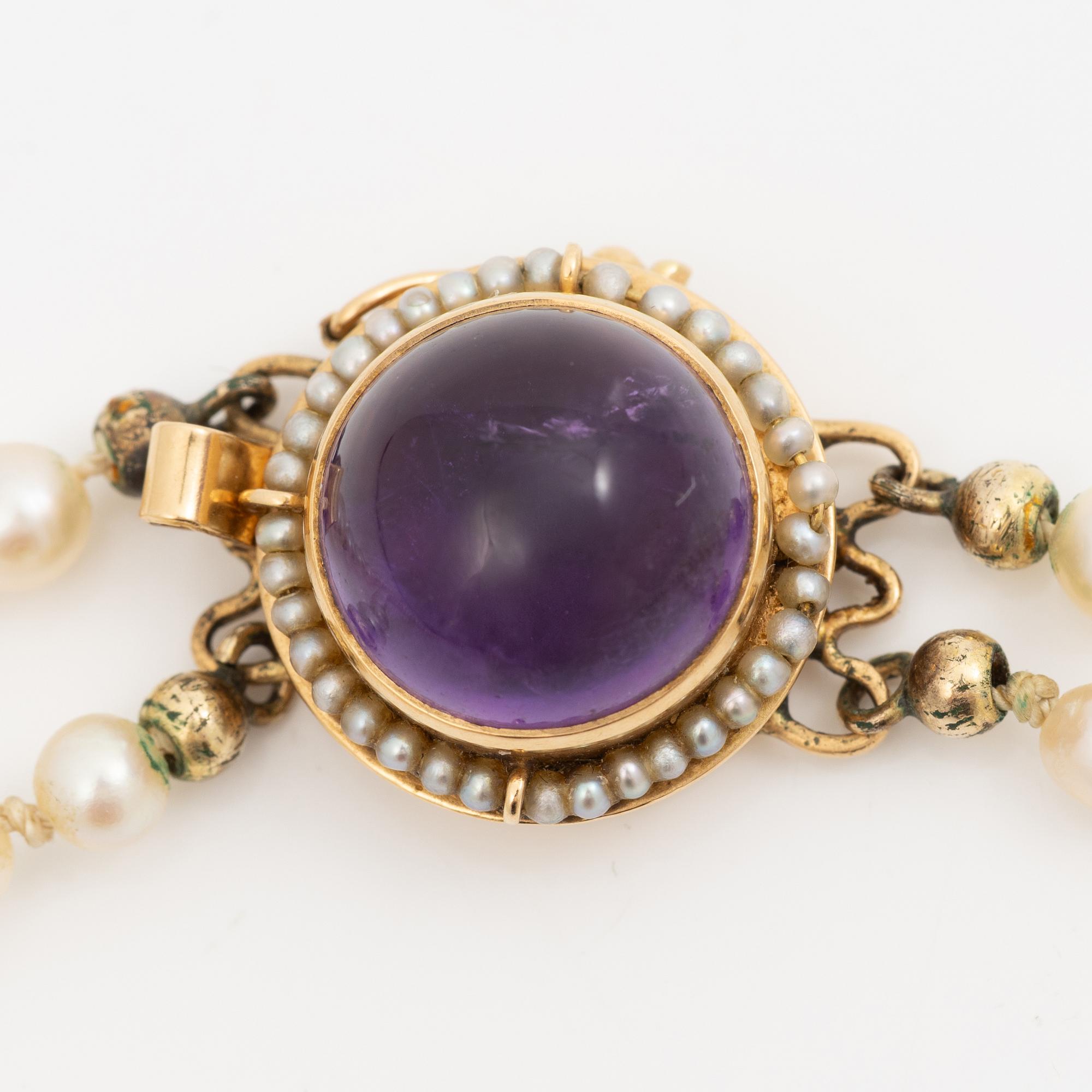 Cultured pearl necklace, double-strand with graduated pearls, Stigbert 18K gold clasp set with a cabochon-cut amethyst.