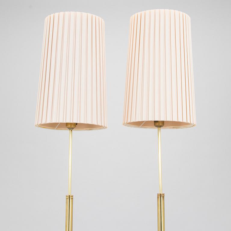 A pair of late 20th century floor lamps.