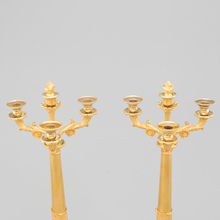 A PAIR OF LATE EMPIRE ORMOLU CANDELABRA, first half of the 19th century.