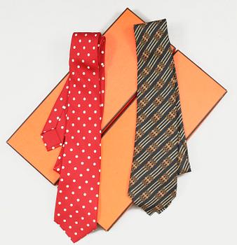 1311. A set of two silk ties by Hermès.