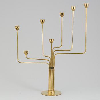 PIET HEIN, a "Ursa Major" brass candelabra, designed 1953.