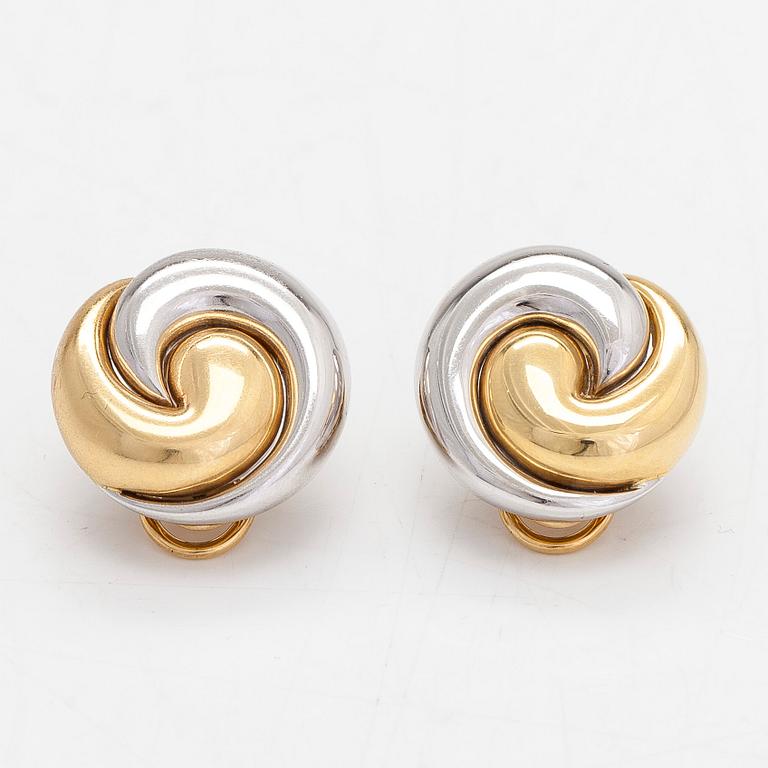 A pair of 18K white and yellow gold earrings.